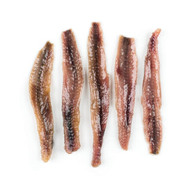 Roland Foods anchovies in olive oil on dish, great for pasta or stews.