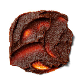Roland Foods red miso paste on kitchen counter a versatile pantry staple for soups and more.
