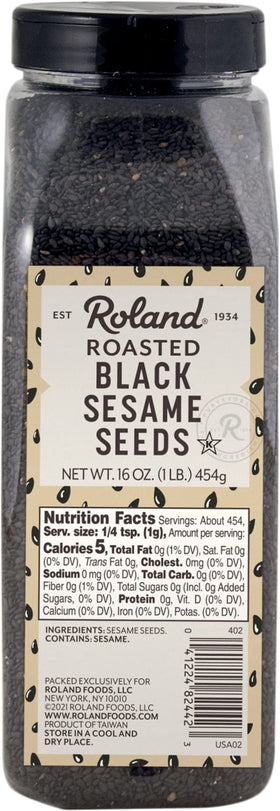 Roland Foods roasted black sesame seeds in container, ready to add nutty flavor to dishes.