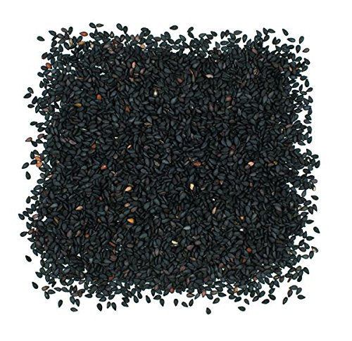 Roland Foods roasted black sesame seeds sprinkled on a dish, enhancing salads and toppings.