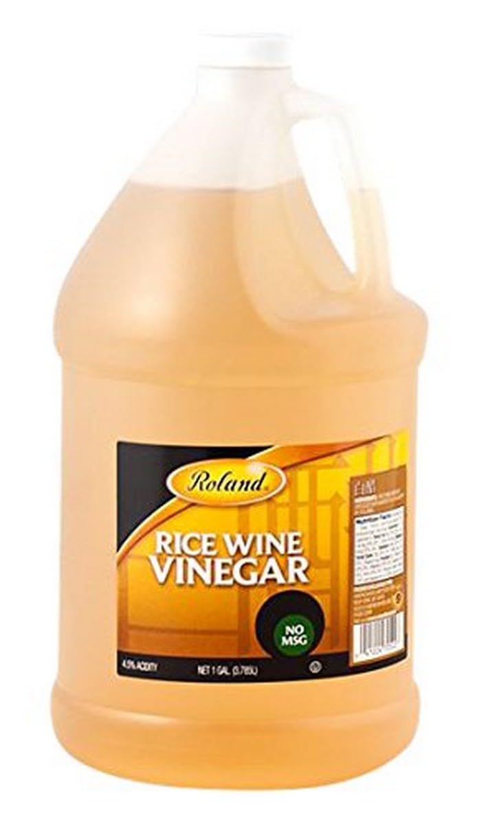 Roland Rice Wine Vinegar bottle being poured for a light tangy salad dressing.