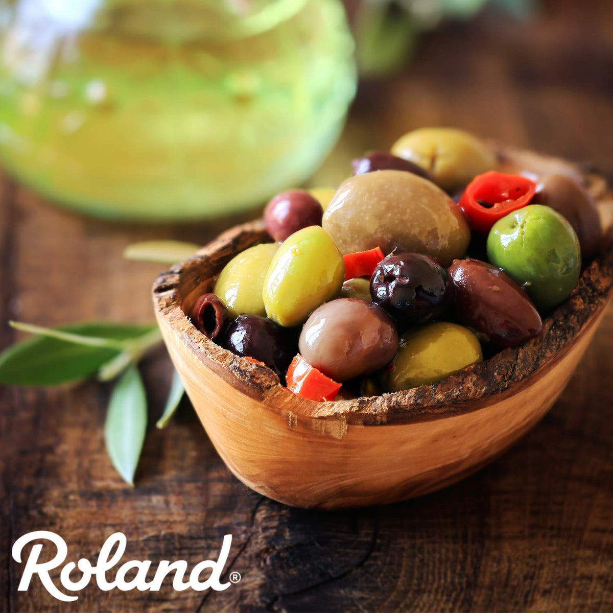 Roland Foods Greek Olive Mix served with crackers for quick snacking.