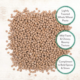 Roland Foods Israeli Couscous side-dish paired with meat and vegetables for quick meals.
