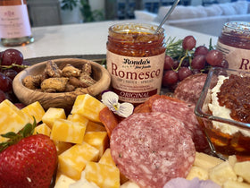 Ronda's Fine Foods Romesco spread on meat close-up with bold, nutty notes