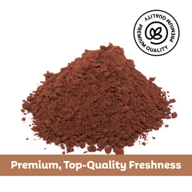 Roots Circle carob powder scoop close-up emphasizes easy measuring for recipes.