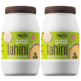 Roots Circle sesame tahini paste creamy texture on a spoon for smooth hummus
