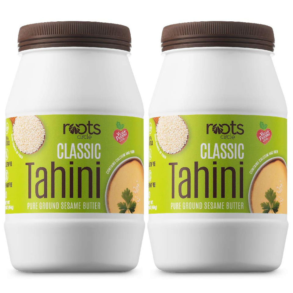 Roots Circle sesame tahini paste creamy texture on a spoon for smooth hummus