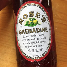 Rose’s Grenadine syrup close-up emphasizes pomegranate flavor and smooth blend.