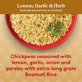 Close-up of lemon, garlic, and parsley on Royal rice with chickpeas.