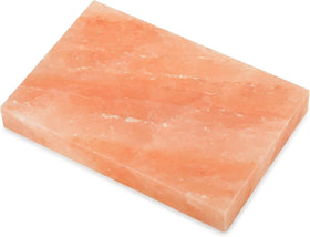 RoyalHouse Himalayan salt block used in outdoor cooking for flavorful results.