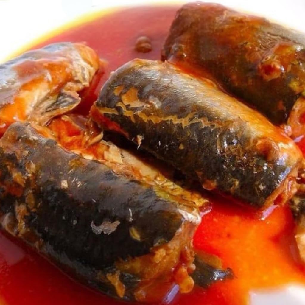 Chili peppers and herbs enhance aroma around Roza mackerel with rice.