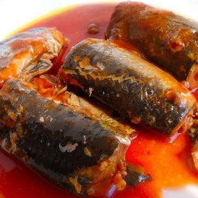 Chili peppers and herbs enhance aroma around Roza mackerel with rice.