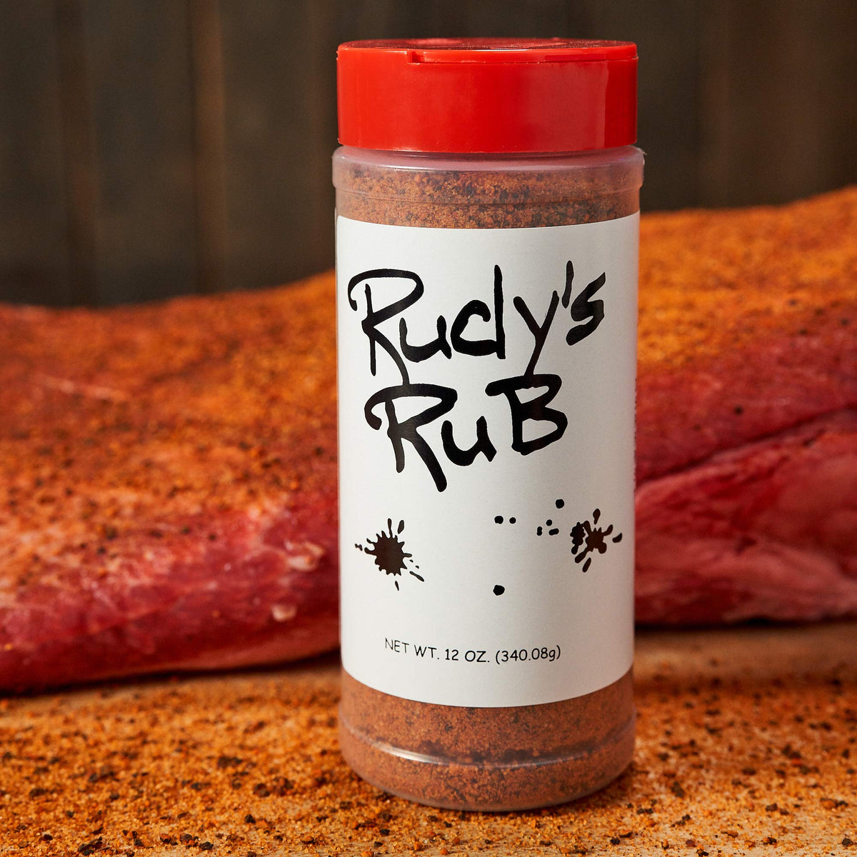 Rudy's dry rub on grilled chicken enhancing crust and aroma