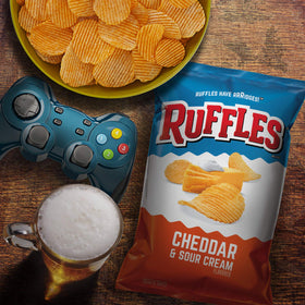 Ruffles Cheddar Sour Cream 1-ounce bag with rich cheese flavor.