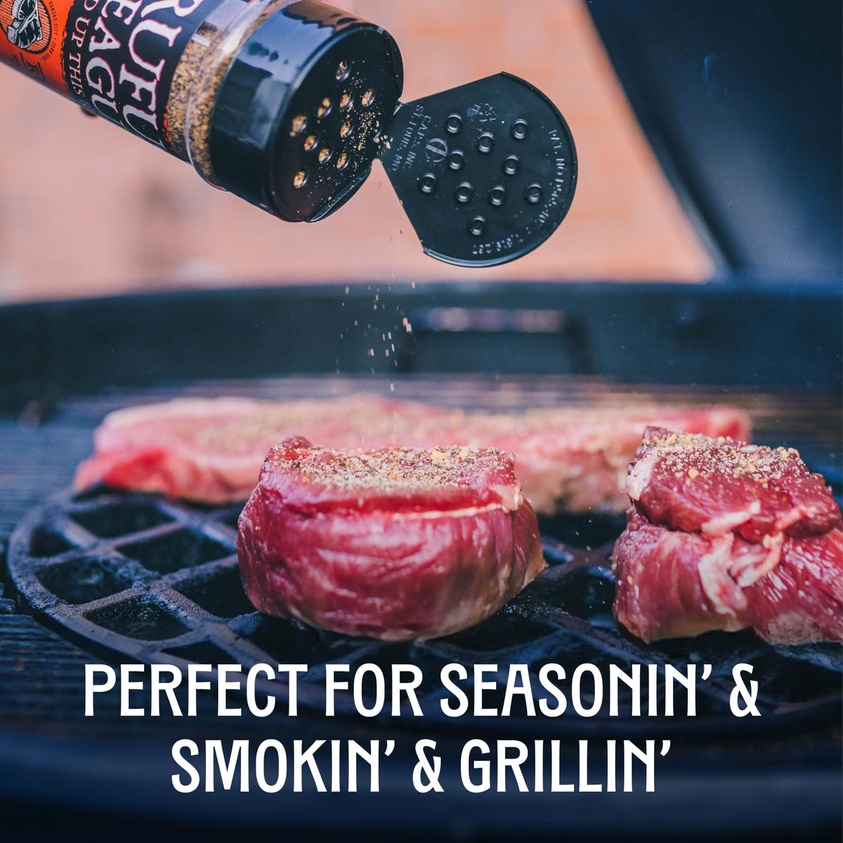 Grill setup with Rufus Teague spices and tongs