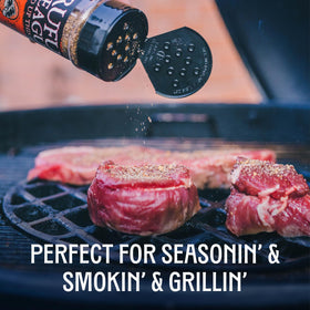 Grill setup with Rufus Teague spices and tongs