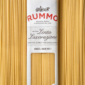 Dish-perfect Rummo pasta plated with light sauce and herbs.