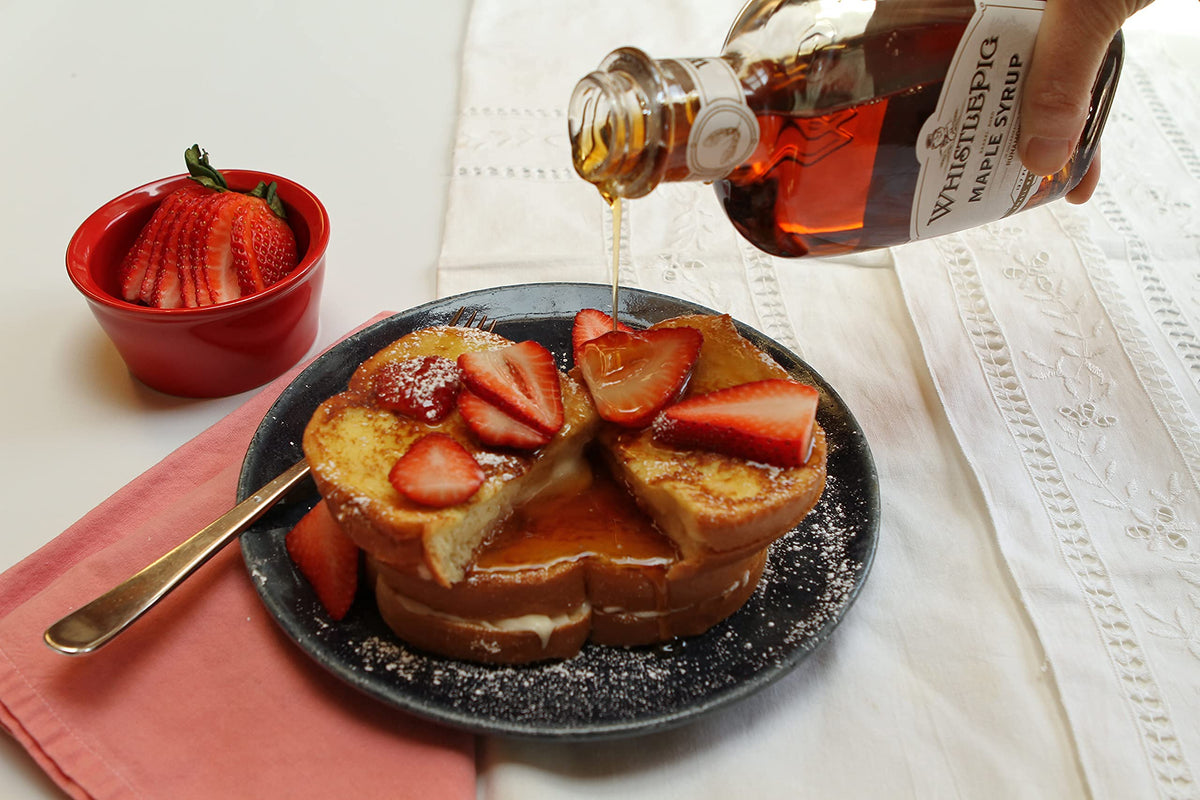 Runamok maple syrup being poured on pancakes to highlight flavor