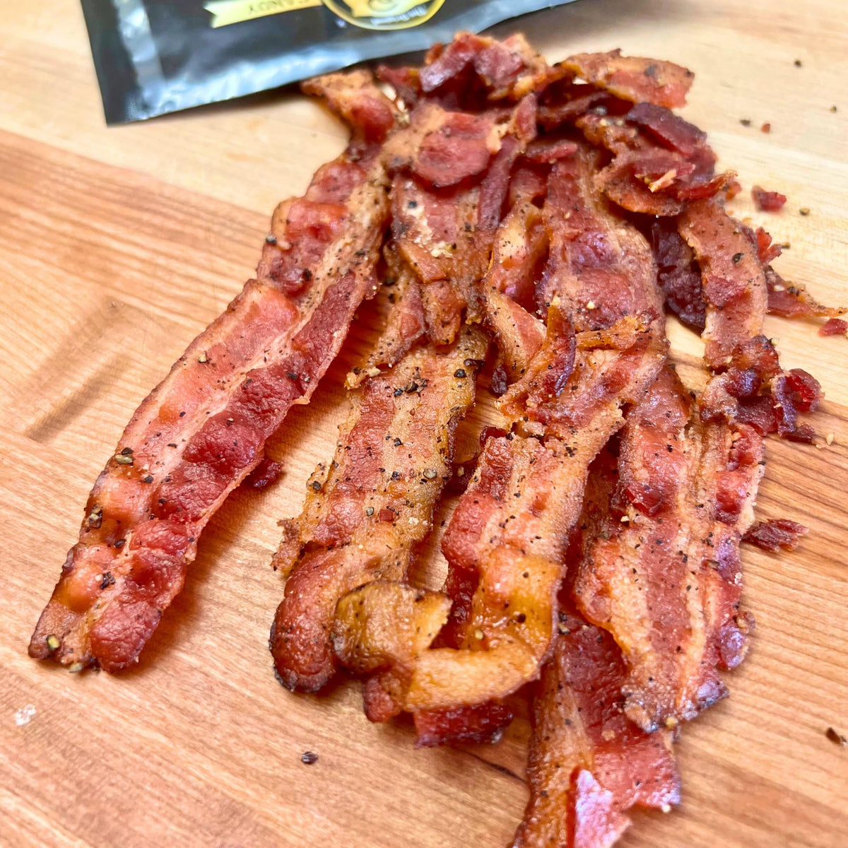 RunninWild Applewood Smoke Bacon Jerky glaze view hints sweet smoky balance in every bite.