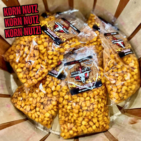 Close-up of RunninWild Korn Nutz showing soft crunch and BBQ coating.