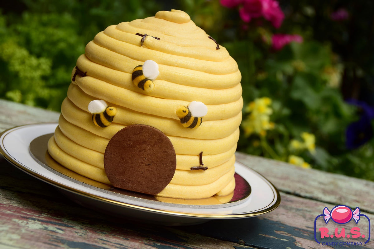 R.U.S. Candy colorful bee decorations brighten baby shower cakes.