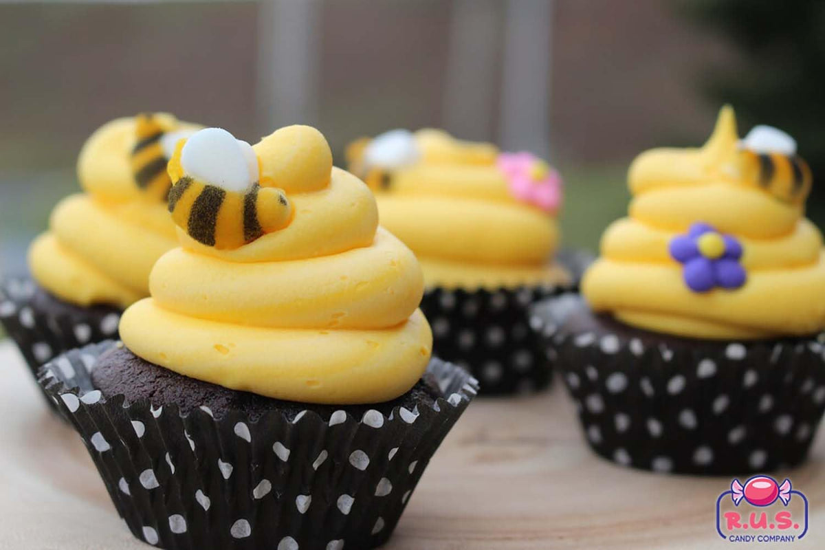 R.U.S. Candy bee decorations brighten desserts with hand-painted colors.