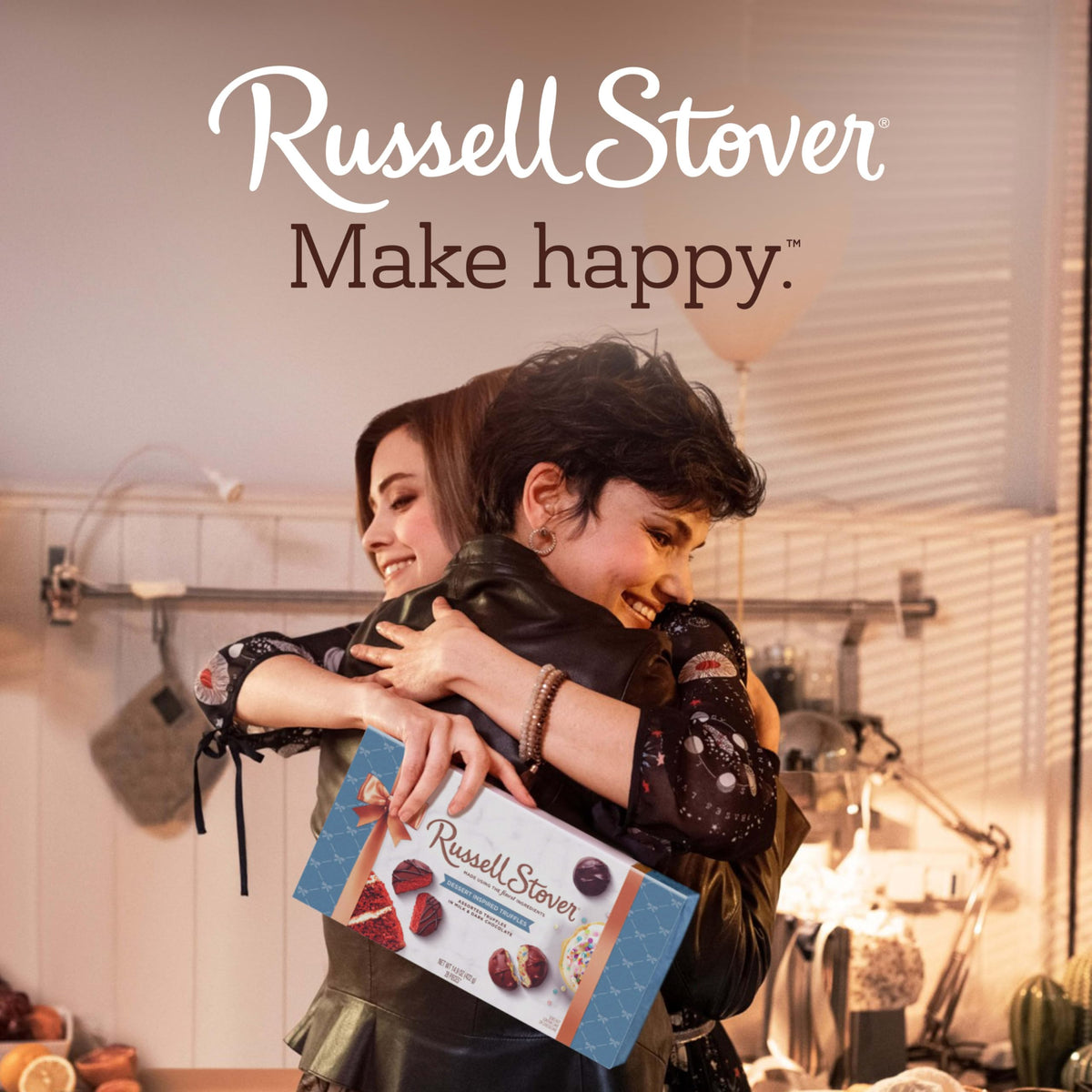 RUSSELL STOVER cheesecake truffle in dark chocolate, tangy-sweet treat for gatherings.
