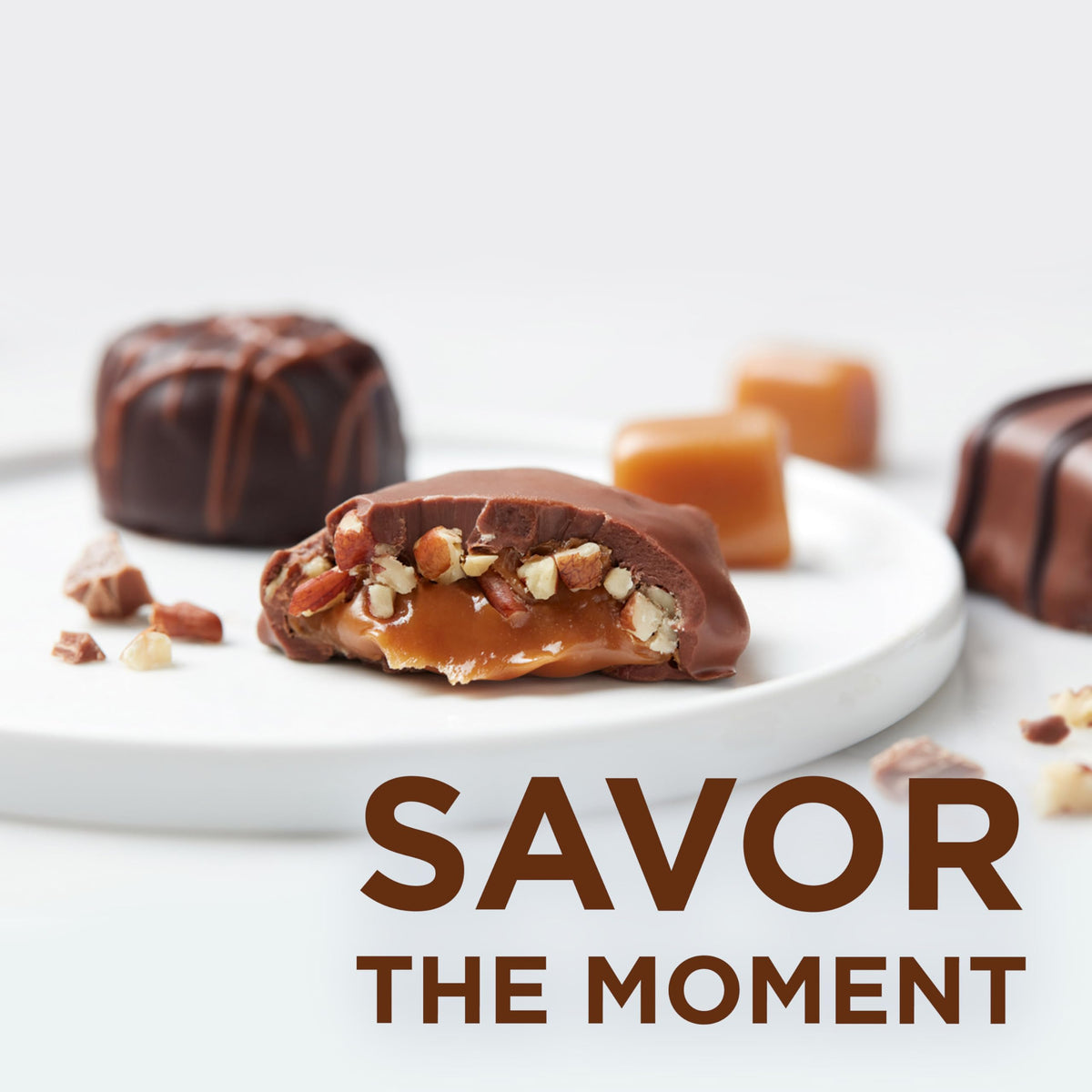 Russell Stover milk chocolate peanut cluster close-up, satisfying crunch and sweetness.