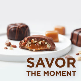 Russell Stover milk chocolate peanut cluster close-up, satisfying crunch and sweetness.