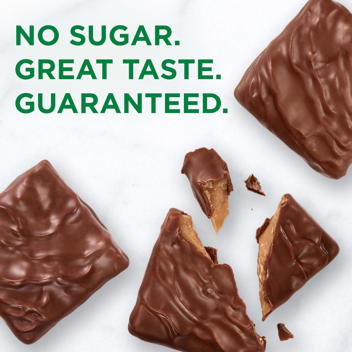 Chocolate-coated toffee square detail highlights smooth texture and flavor.