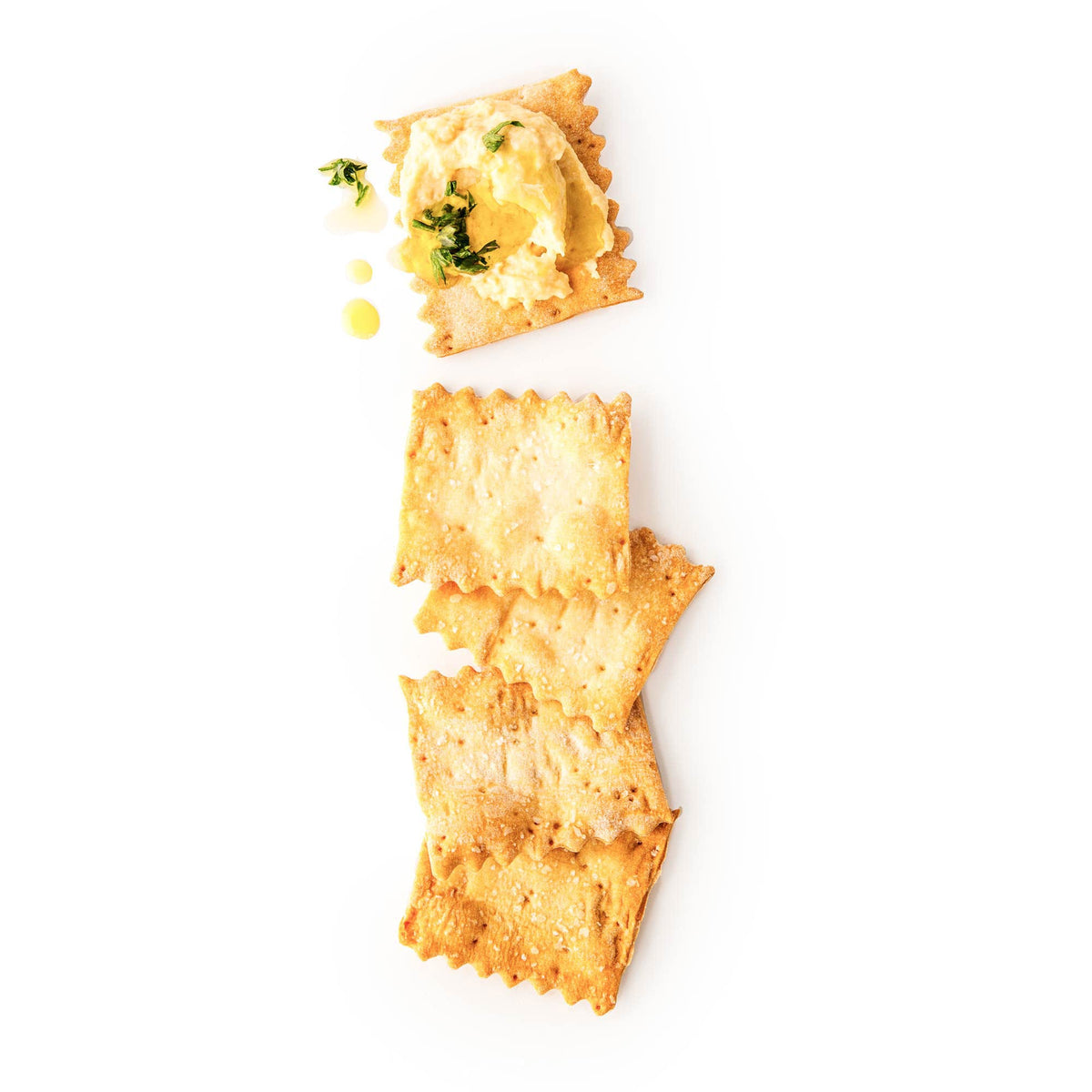 Rustic Bakery crackers on a cheese plate, ideal for soft and hard cheeses.