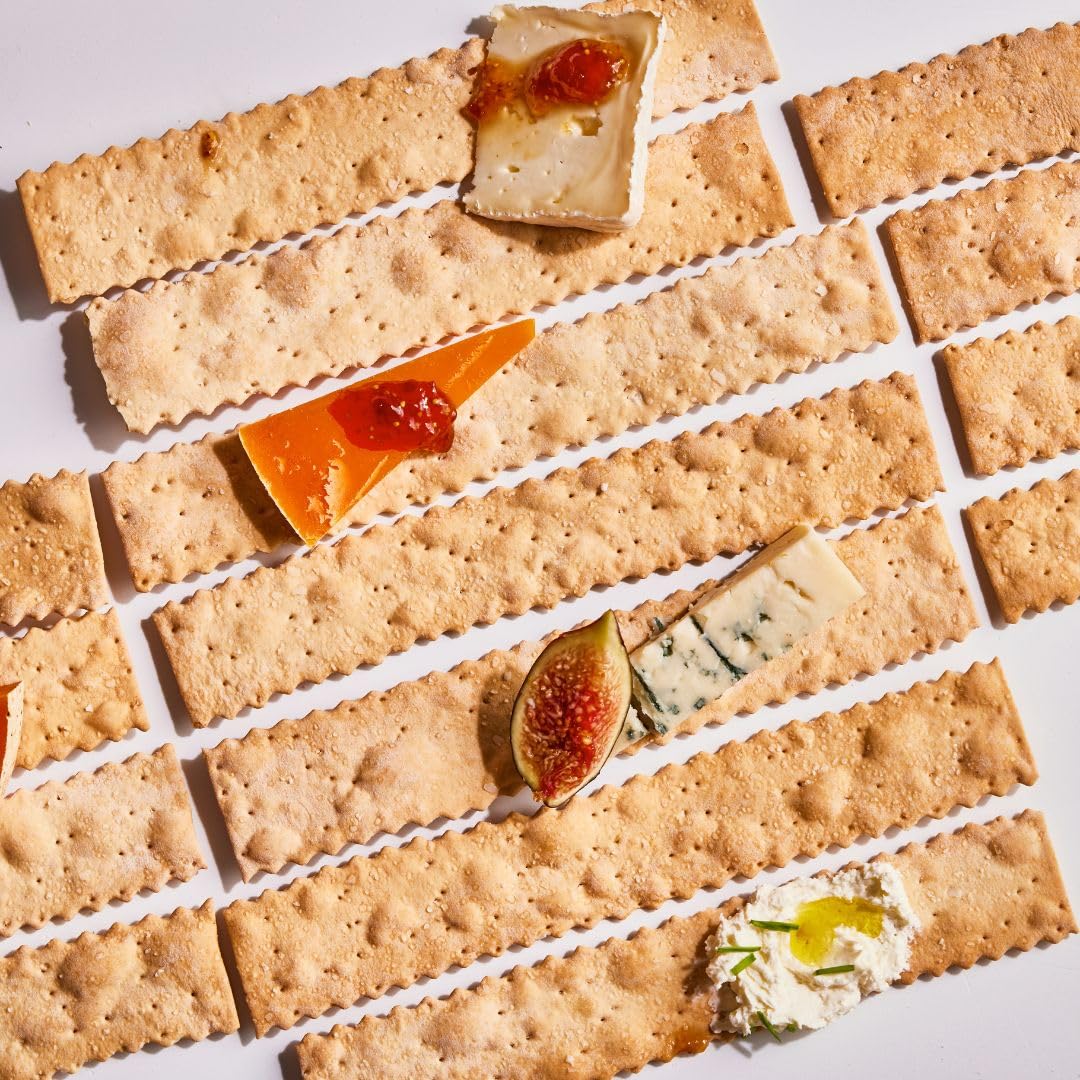 Rustic Bakery crackers on a cheese board pair well with soft and hard cheeses