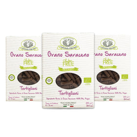Rustichella d'Abruzzo organic buckwheat tortiglioni pack-3 packaging highlighting gluten-free, artisanal pasta quality.
