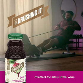R.W. Knudsen Organic Beet Juice in a glass on ice with a vibrant color.