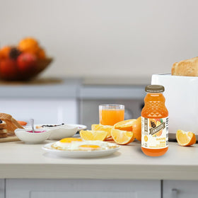 Close-up of Morning Blend ingredients including pineapple, apple, and orange.