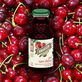 Glass of R.W. Knudsen Tart Cherry Juice on ice, revitalizing and vibrant