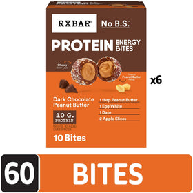 Close-up of RXBAR bite with chewy outer layer and creamy peanut butter filling.