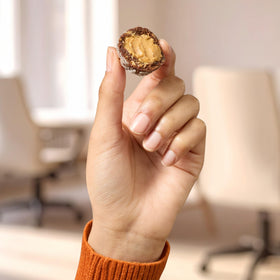 RXBAR Energy Bites in hand, showcasing portable energy boost