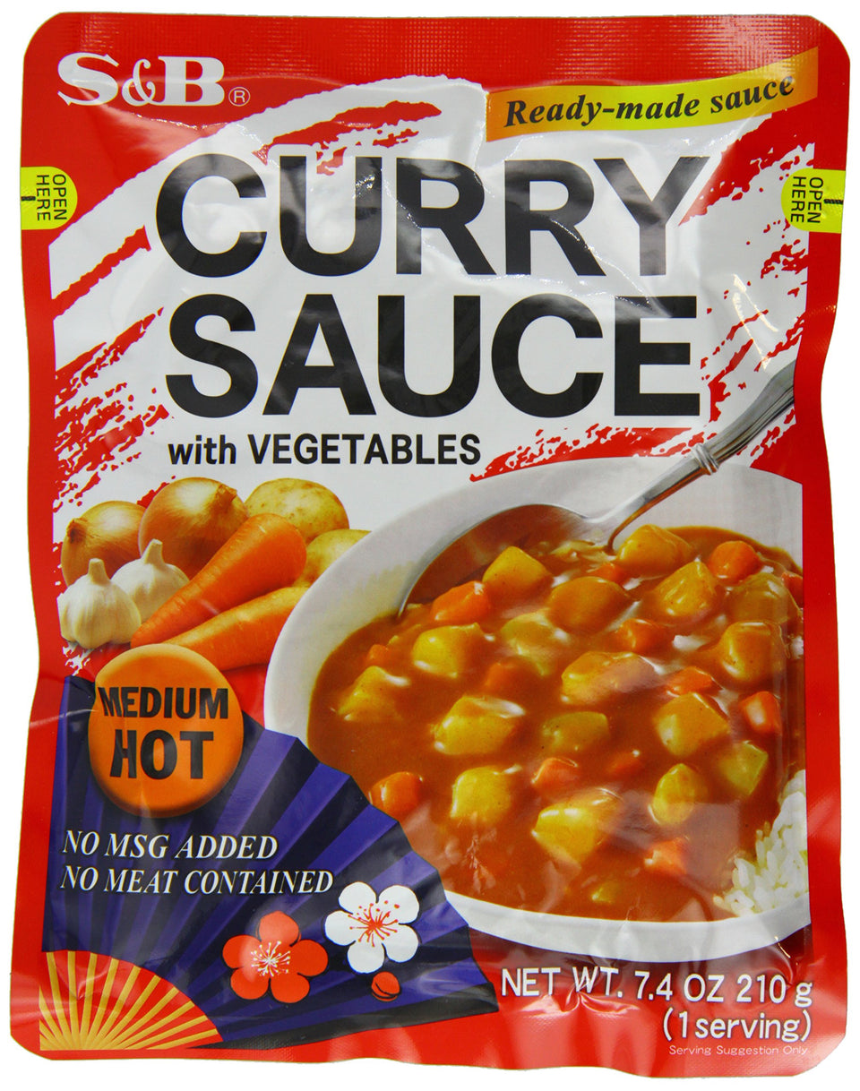 S&B Curry Sauce with Vegetables Medium Hot bottle pour for quick weeknight meals.