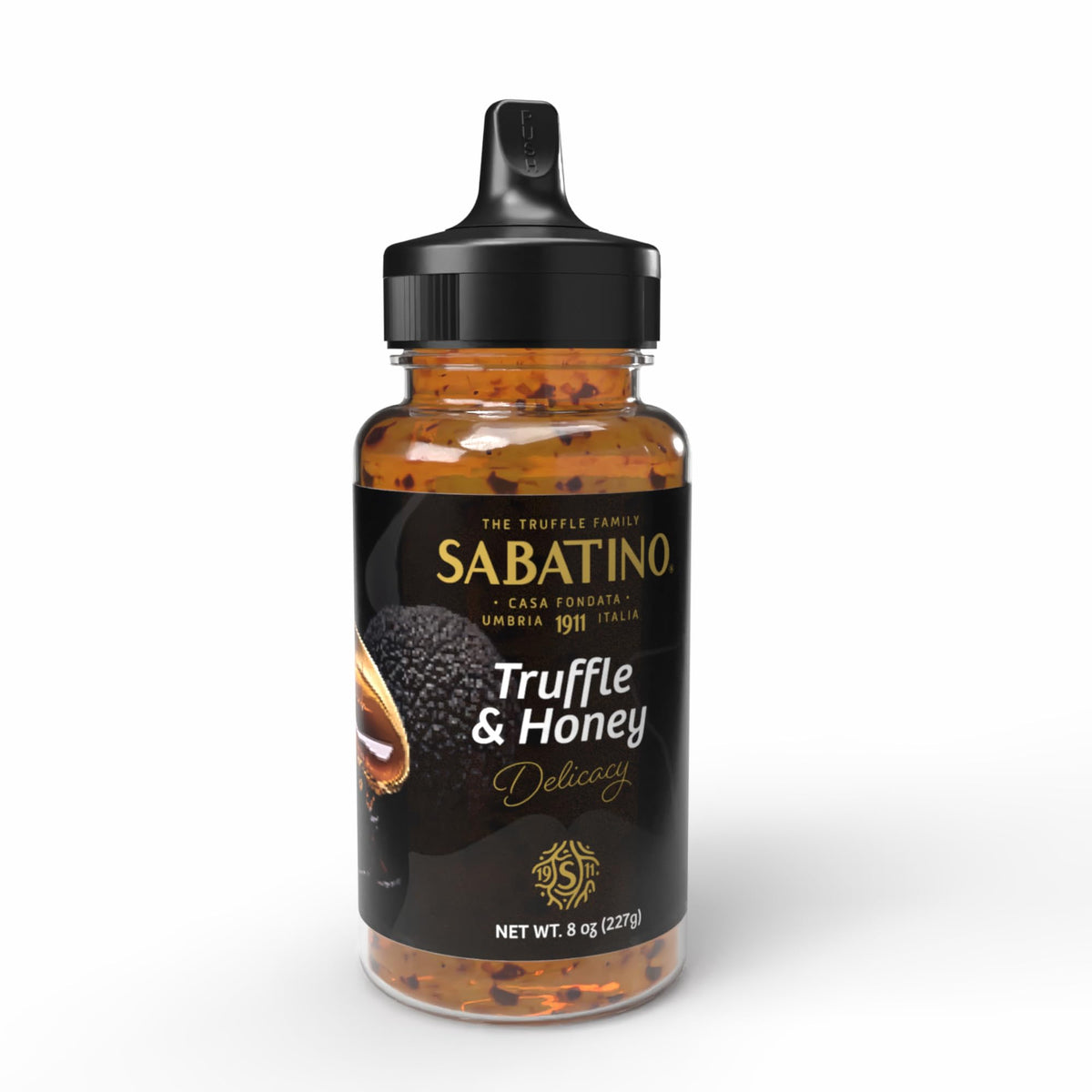 Sabatino Tartufi truffle honey bottle on a cheese board, highlighting savory-sweet pairing.