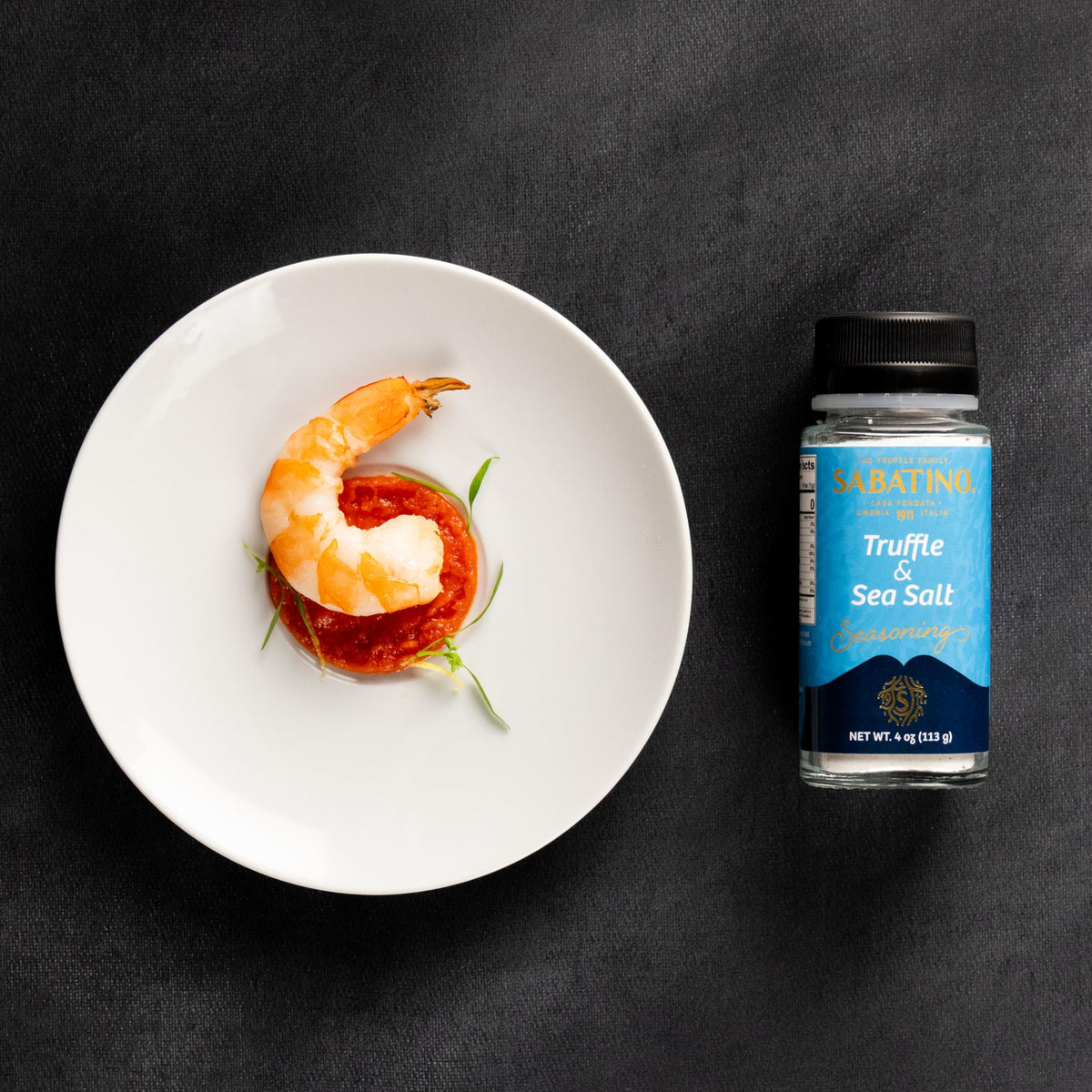 Sabatino Tartufi truffle salt on meat delivers rich flavor.