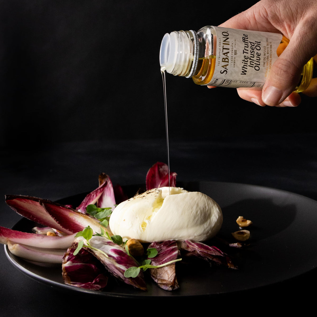 Sabatino Tartufi olive oil finish on pasta plate showing premium flavor