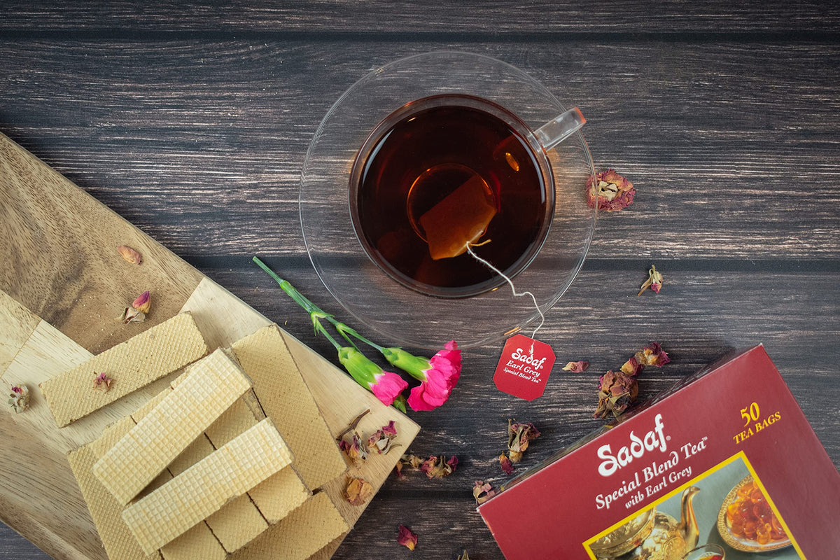 Sadaf Earl Grey tea bags brewed cup with steam and inviting aroma.