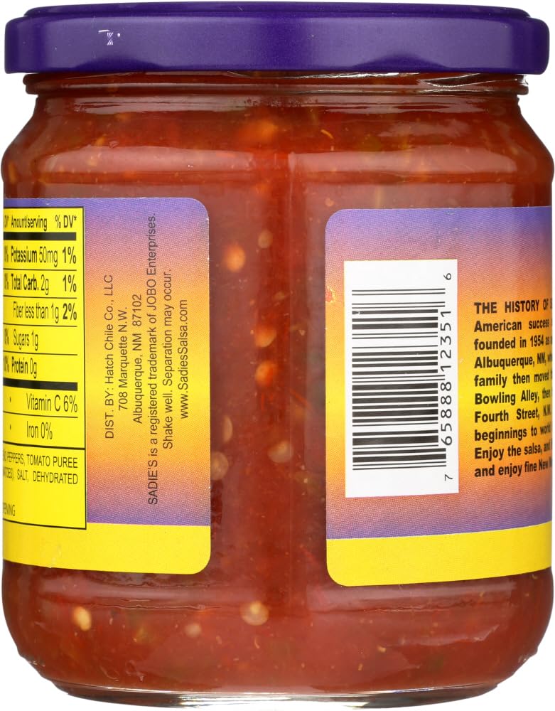 Sadie's Not As Hot Salsa jar pouring into bowl, ideal for quick recipe boosts.