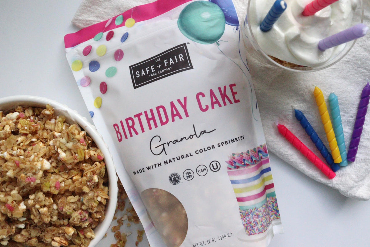 Safe + Fair Birthday Cake Granola packaging next to smoothie.