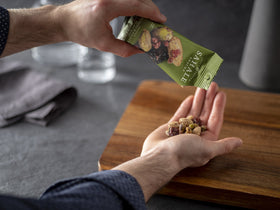 Sahale Snacks pomegranate pistachios glazed mix as a dessert topping on pear bread pudding.