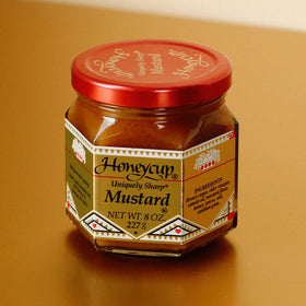 Salthouse & Peppermongers Honeycup Mustard glaze over roasted chicken for a glossy finish.
