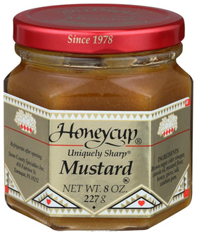 Salthouse & Peppermongers Honeycup Mustard bottle being poured, adding tangy sweetness.