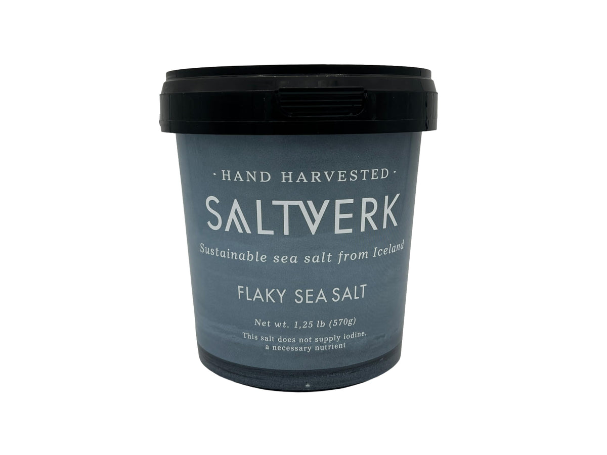 Saltverk sea salt flakes in a 1.25 lb tub add crisp flavor to dishes.
