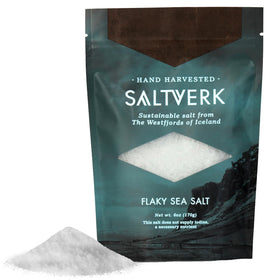 Saltverk sea salt flakes in a glass jar ready to finish dishes with crisp flavor